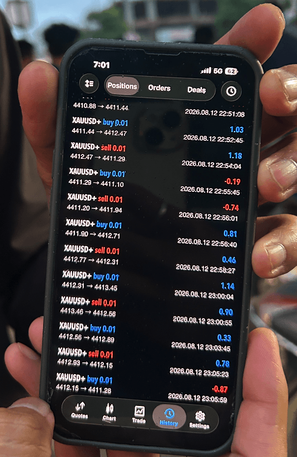Client phone screenshot showing MT5 XAUUSD live trade results